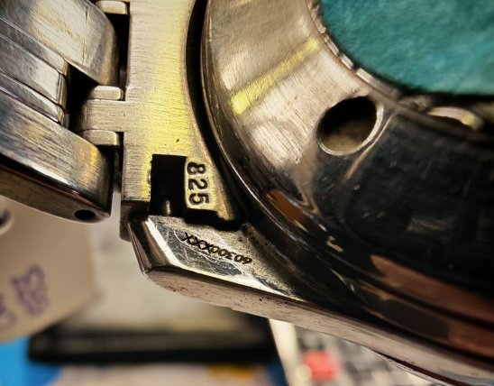 location of serial number and caliber number on an omega watch case